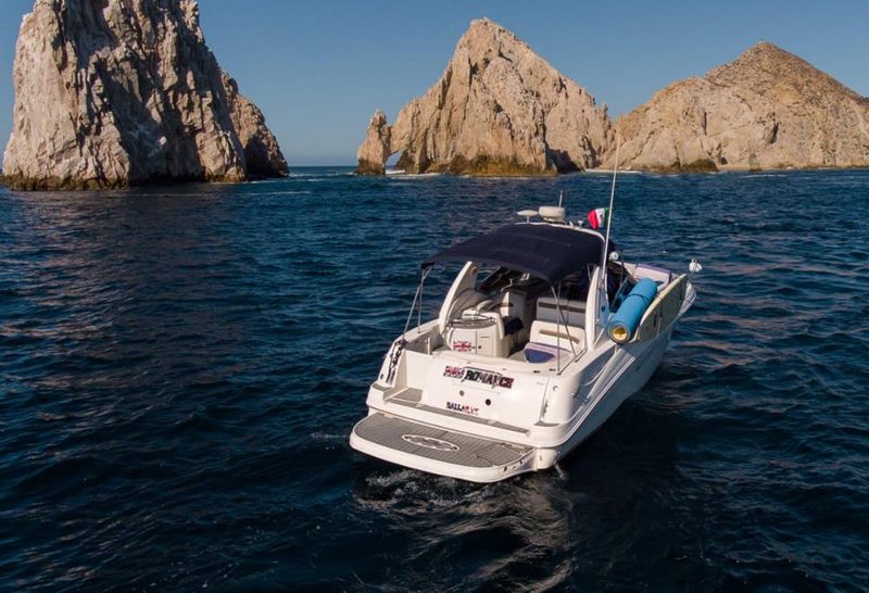 32-foot Sea Ray cruising near the granite rocks of Land's End