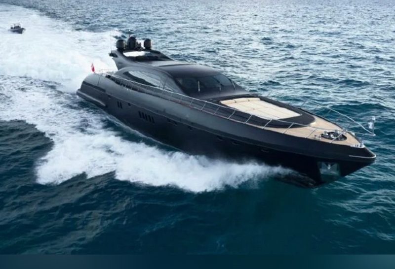 Matte black 108-foot Mangusta superyacht cruising at speed